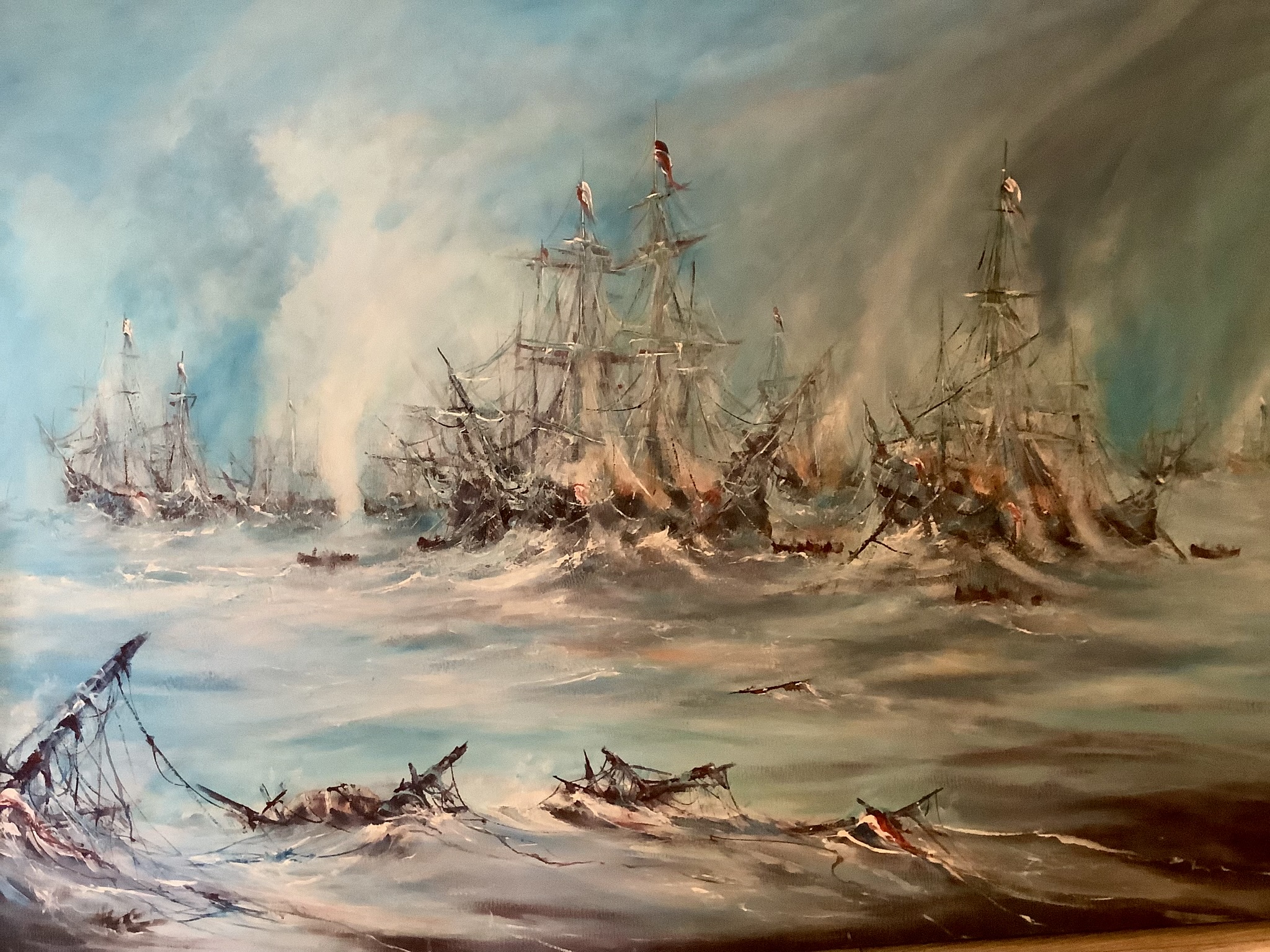 A british frigate boat on some choppy seas after a large naval war
