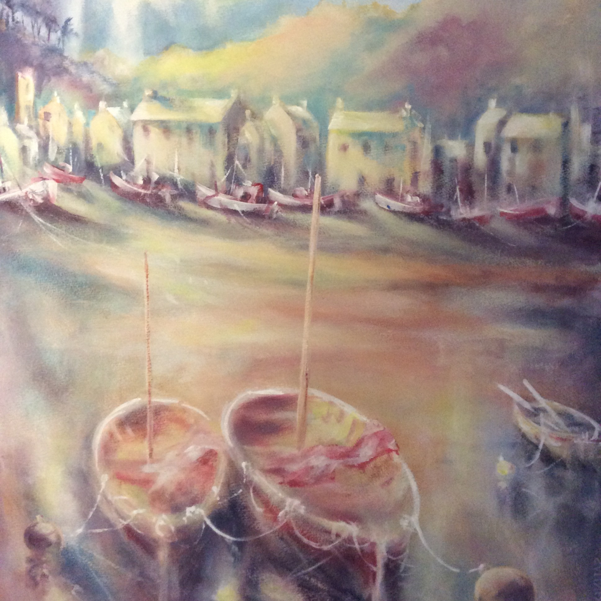 Small boats moored in a town harbour