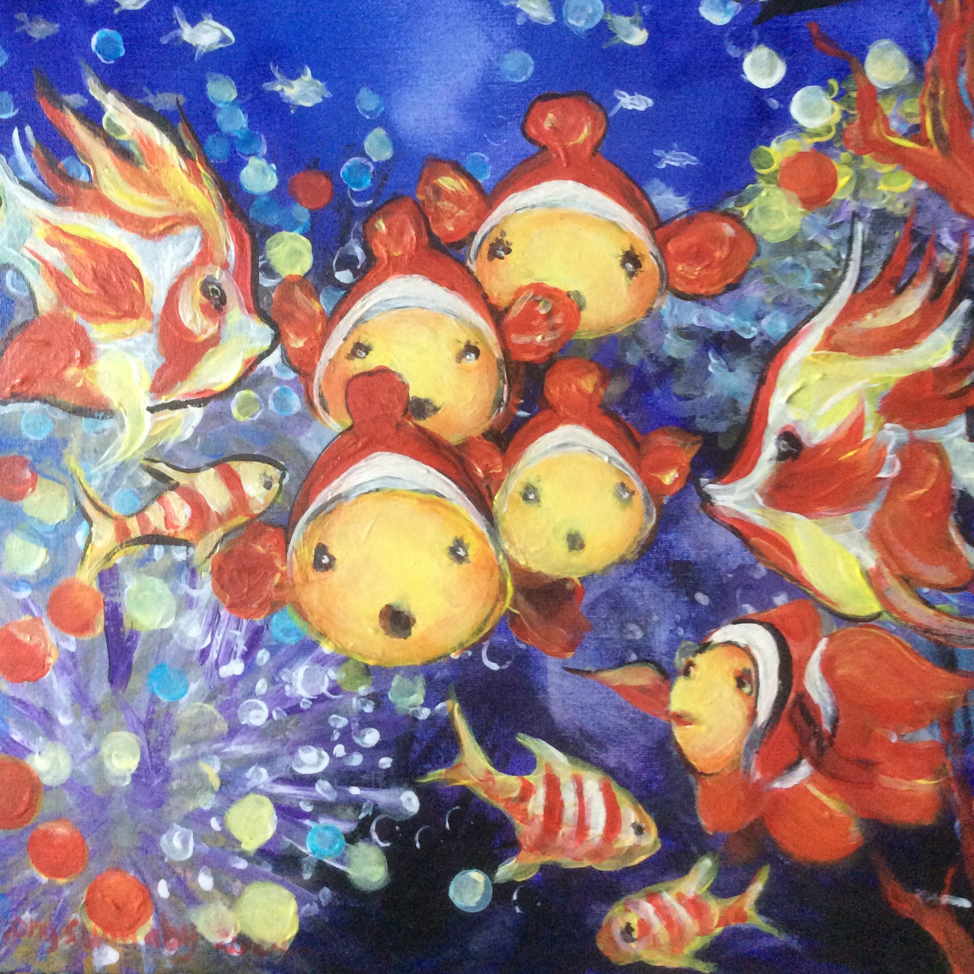 A school of clownfish in an underwater scene