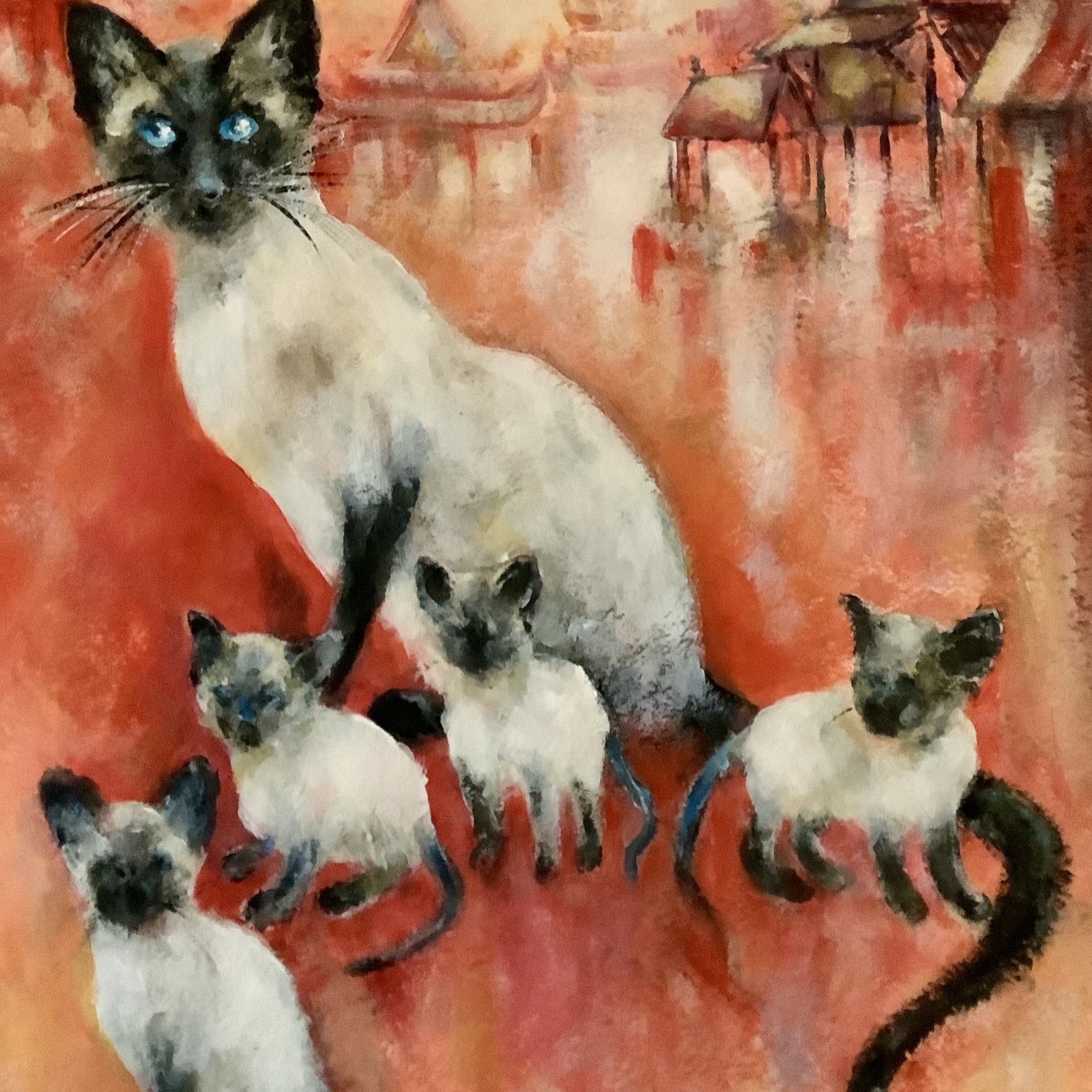 A Siamese cat family