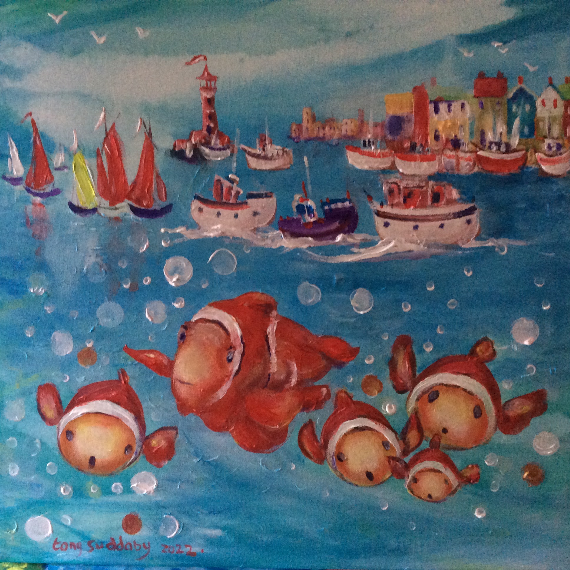 Fishes hiding under some boats