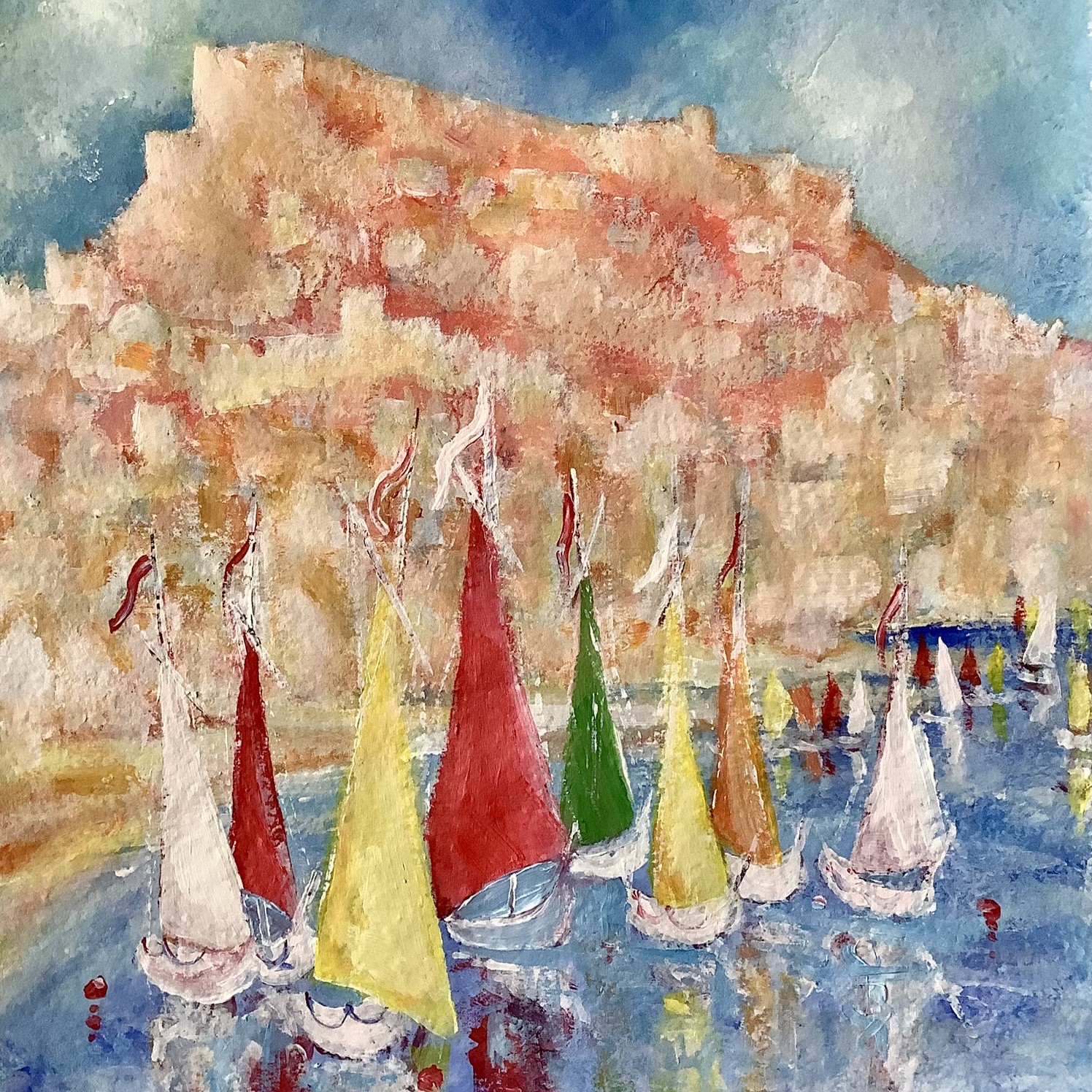 Alicante castle with the harbour full of colourful boats
