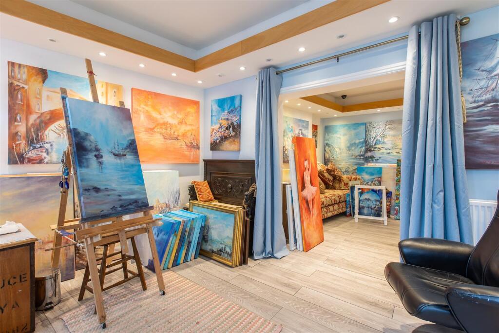 An image of a studio filled with the artists own pictures